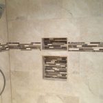 Installed walk-in shower with tiled niche